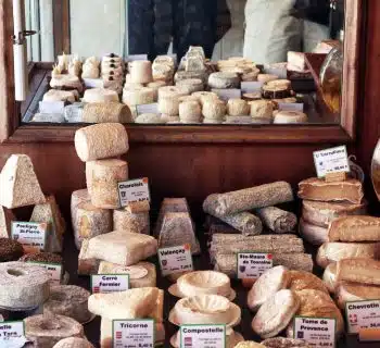 a bunch of different types of bread on a table