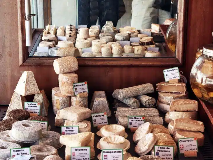 a bunch of different types of bread on a table